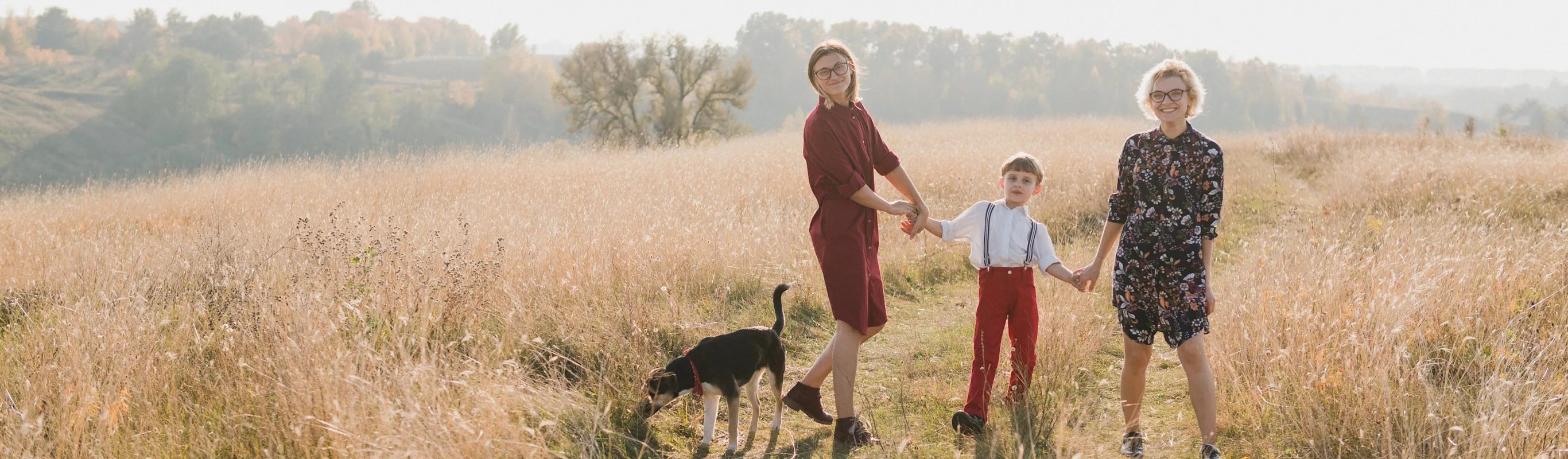 family in field and dog family in field and dog