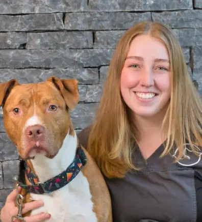 A portrait photo of Jacqui with an Pit Bull Terrier