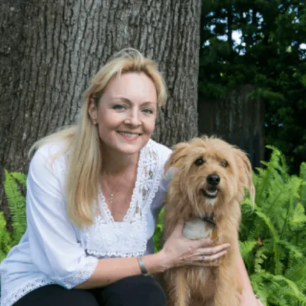 Allison Steele Wegmann with a brown dog