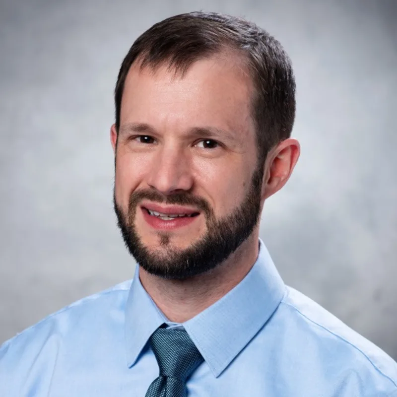 Brady Boyle wearing a blue dress shirt and tie Brady Boyle wearing a blue dress shirt and tie