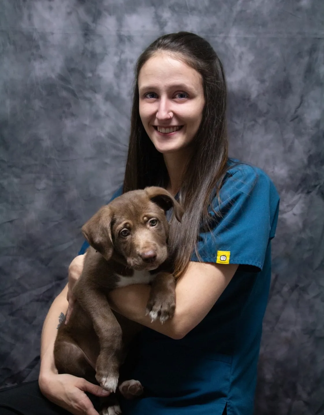 Heidi holding a brown dog Heidi holding a brown dog