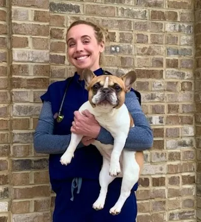 Dr. Blair Cornman holding puppy Dr. Blair Cornman holding puppy