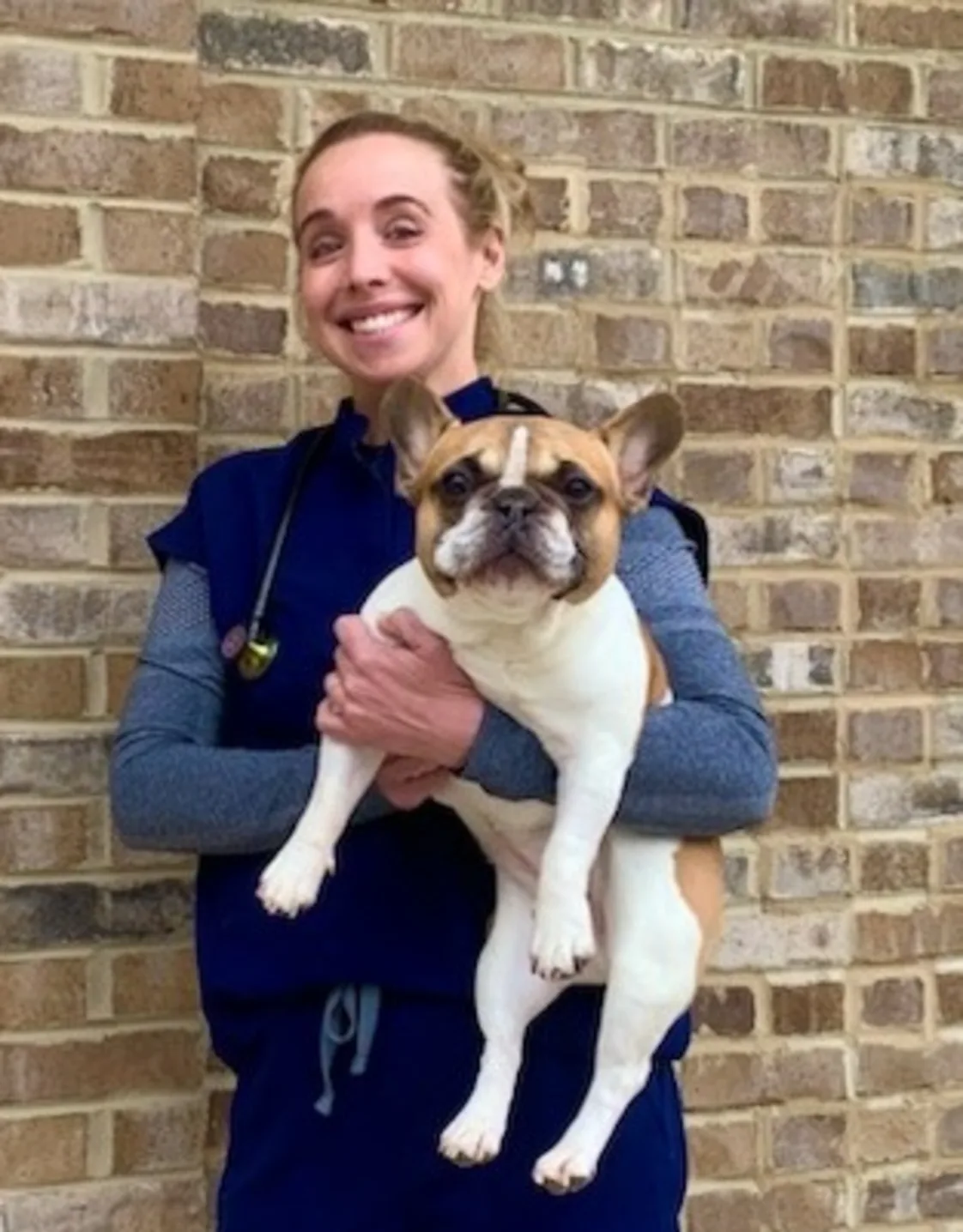Dr. Blair Cornman holding puppy Dr. Blair Cornman holding puppy