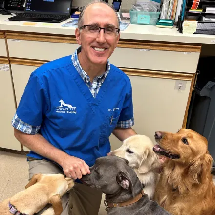 Dr. William Kestler with black and white dog