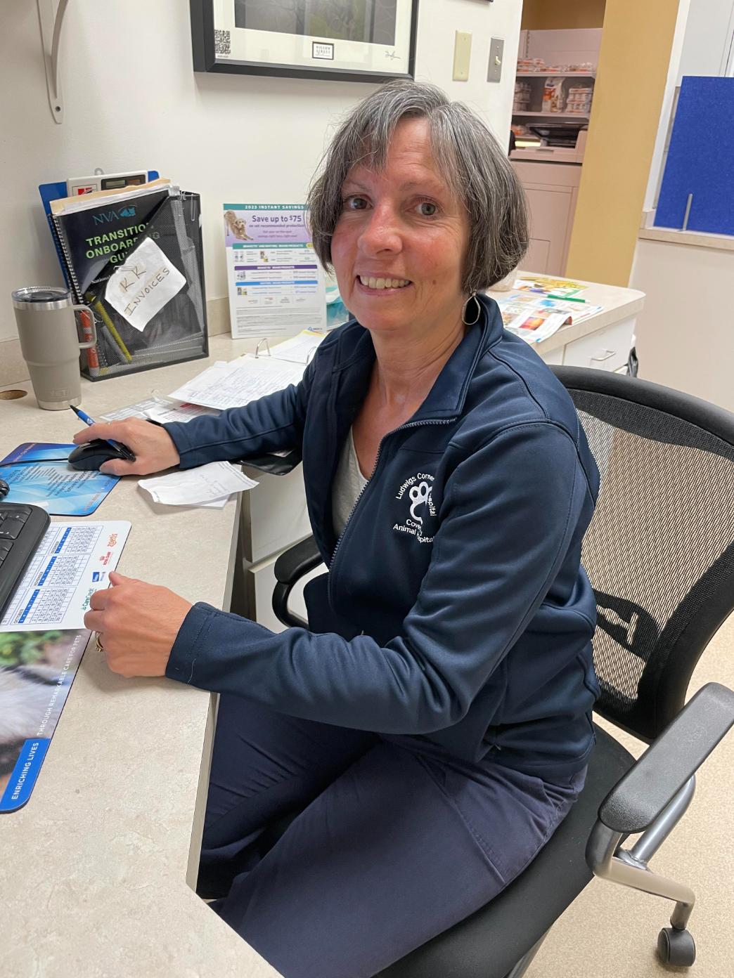 Karen K. sitting down at desk