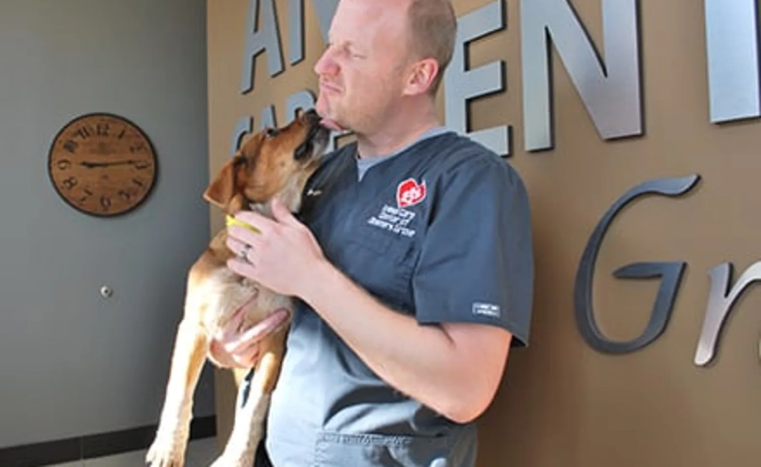Animal Care Center of Downers Grove Vet with dog Animal Care Center of Downers Grove Vet with dog
