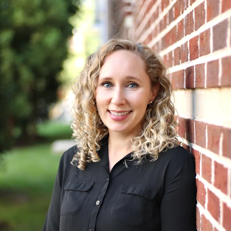 Lindsay Wood outside with a black blouse. Lindsay Wood outside with a black blouse.