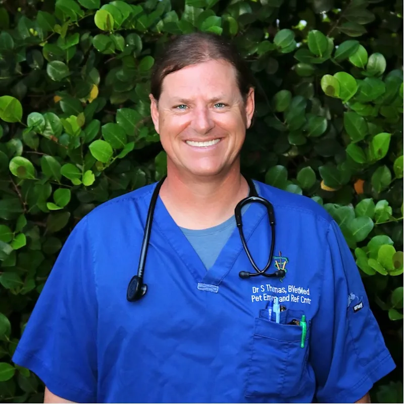 Dr. Sean Thomas Holding a two dogs Dr. Sean Thomas Holding a two dogs