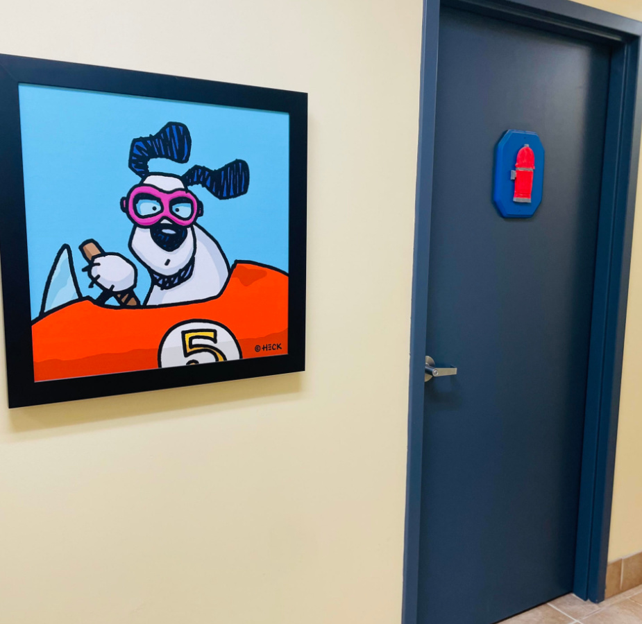 Painting of Dog Driving a Car in Huffard Lobby