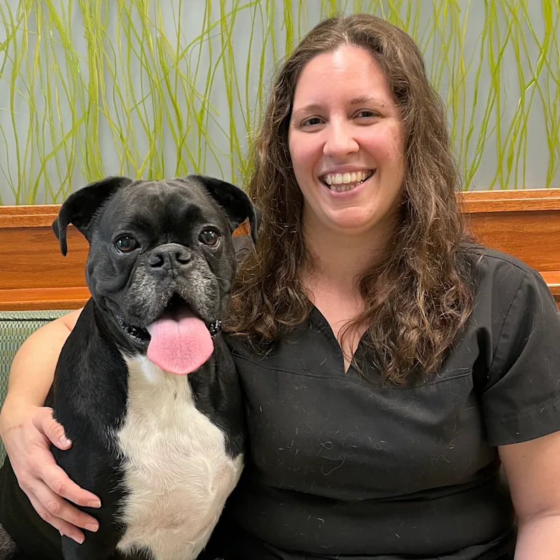 Dr. Melissa Diaz with a dog Dr. Melissa Diaz with a dog
