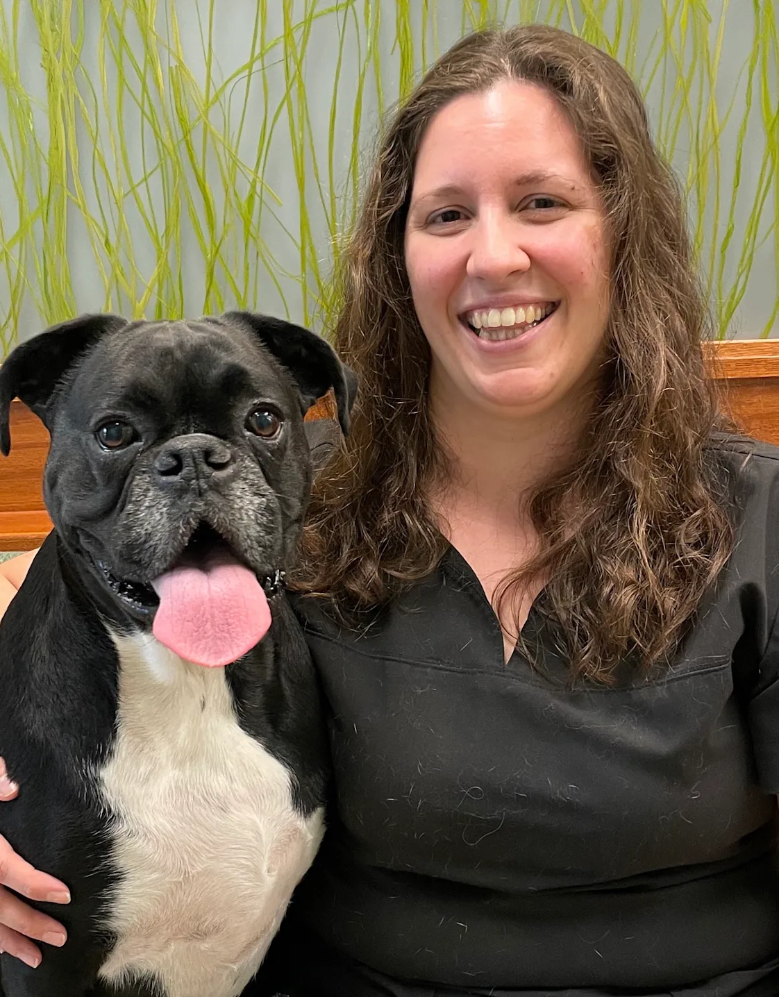 Dr. Melissa Diaz with a dog Dr. Melissa Diaz with a dog