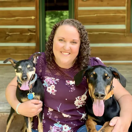 Dr. Laura Gibson WITH TWO DOGS