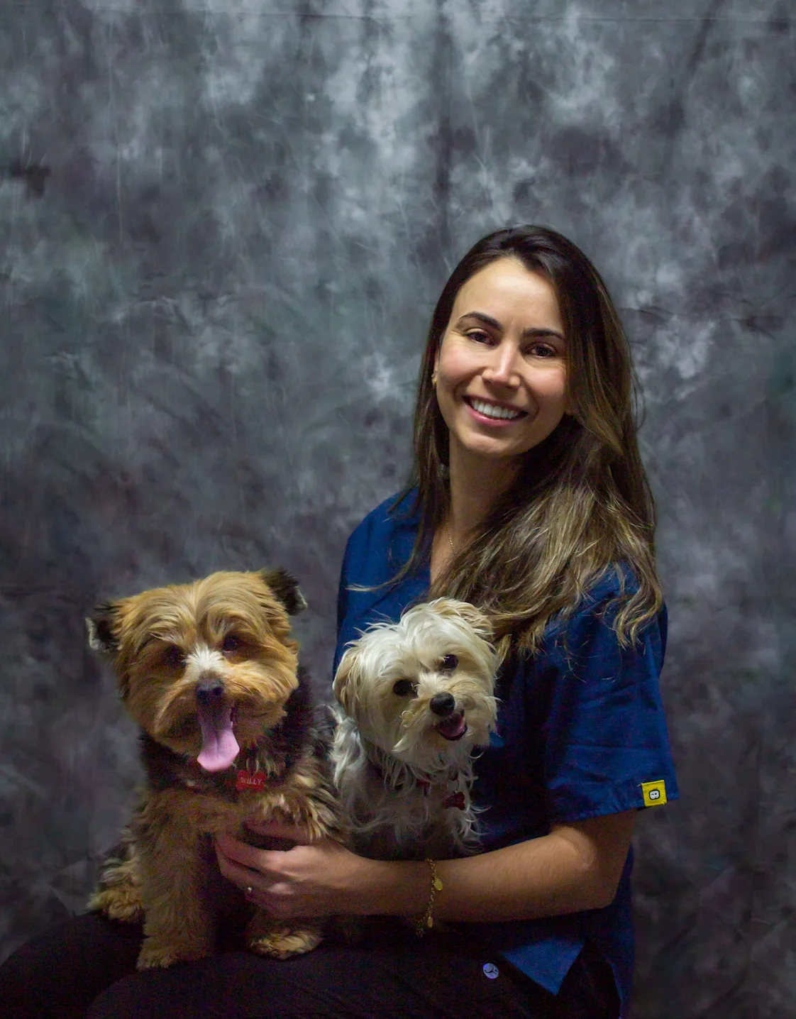 Tammy holding two little dogs in her lap Tammy holding two little dogs in her lap