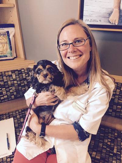 Vet posing with puppy