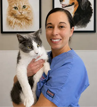Lindy's staff photo from Spanish Trail Animal Hospital where she is posing with a grey cat Lindy's staff photo from Spanish Trail Animal Hospital where she is posing with a grey cat