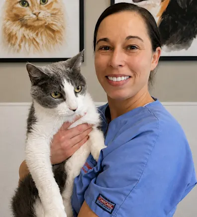 Lindy's staff photo from Spanish Trail Animal Hospital where she is posing with a grey cat Lindy's staff photo from Spanish Trail Animal Hospital where she is posing with a grey cat