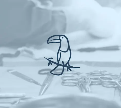 Surgical instruments and an avian toucan logo Surgical instruments and an avian toucan logo