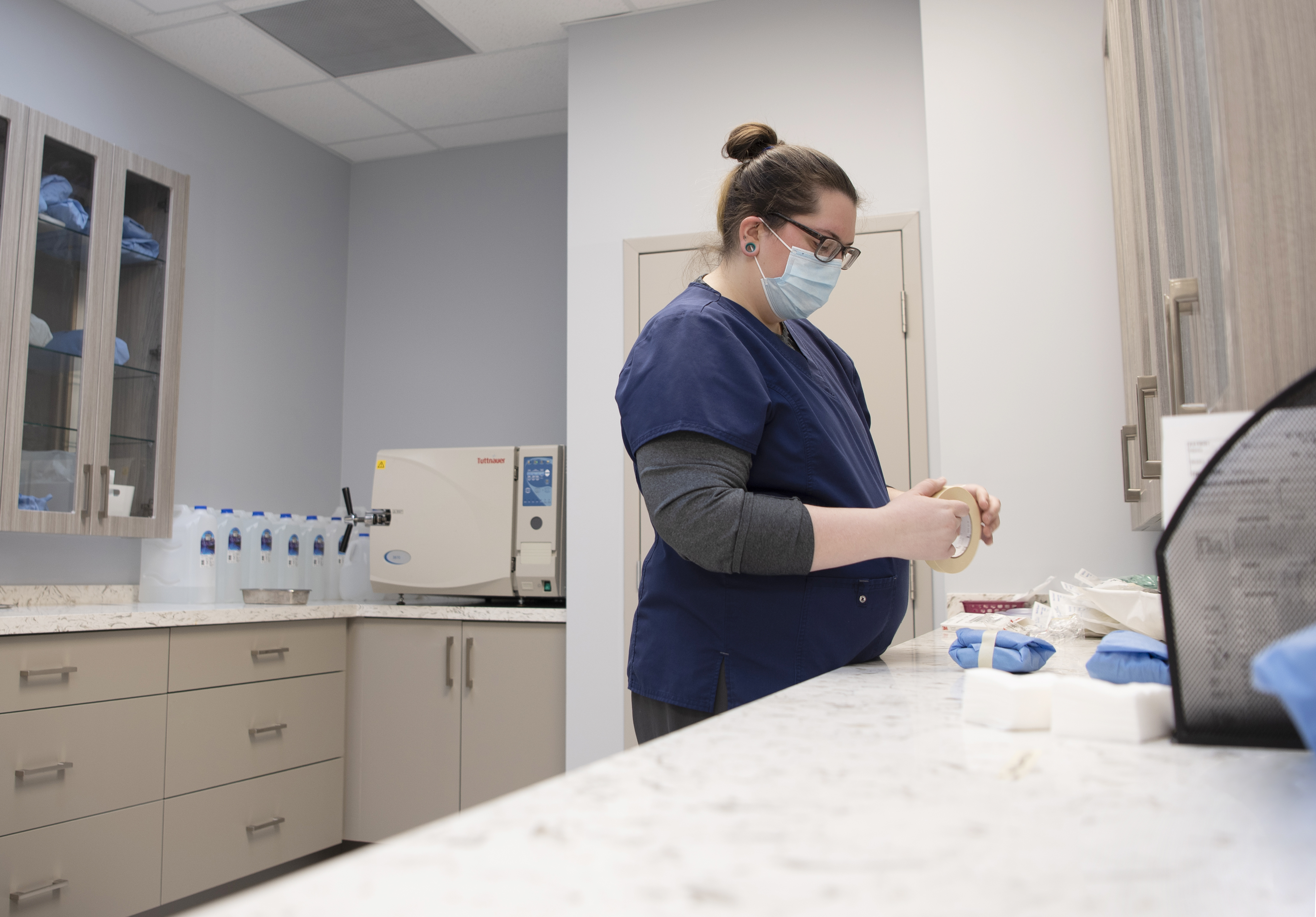 Staff getting bandage ready