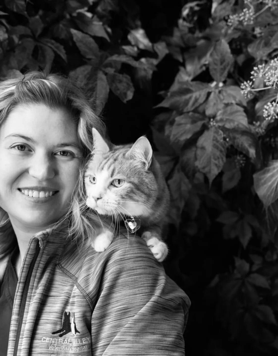Erika taking a picture with her cat on her shoulder Erika taking a picture with her cat on her shoulder