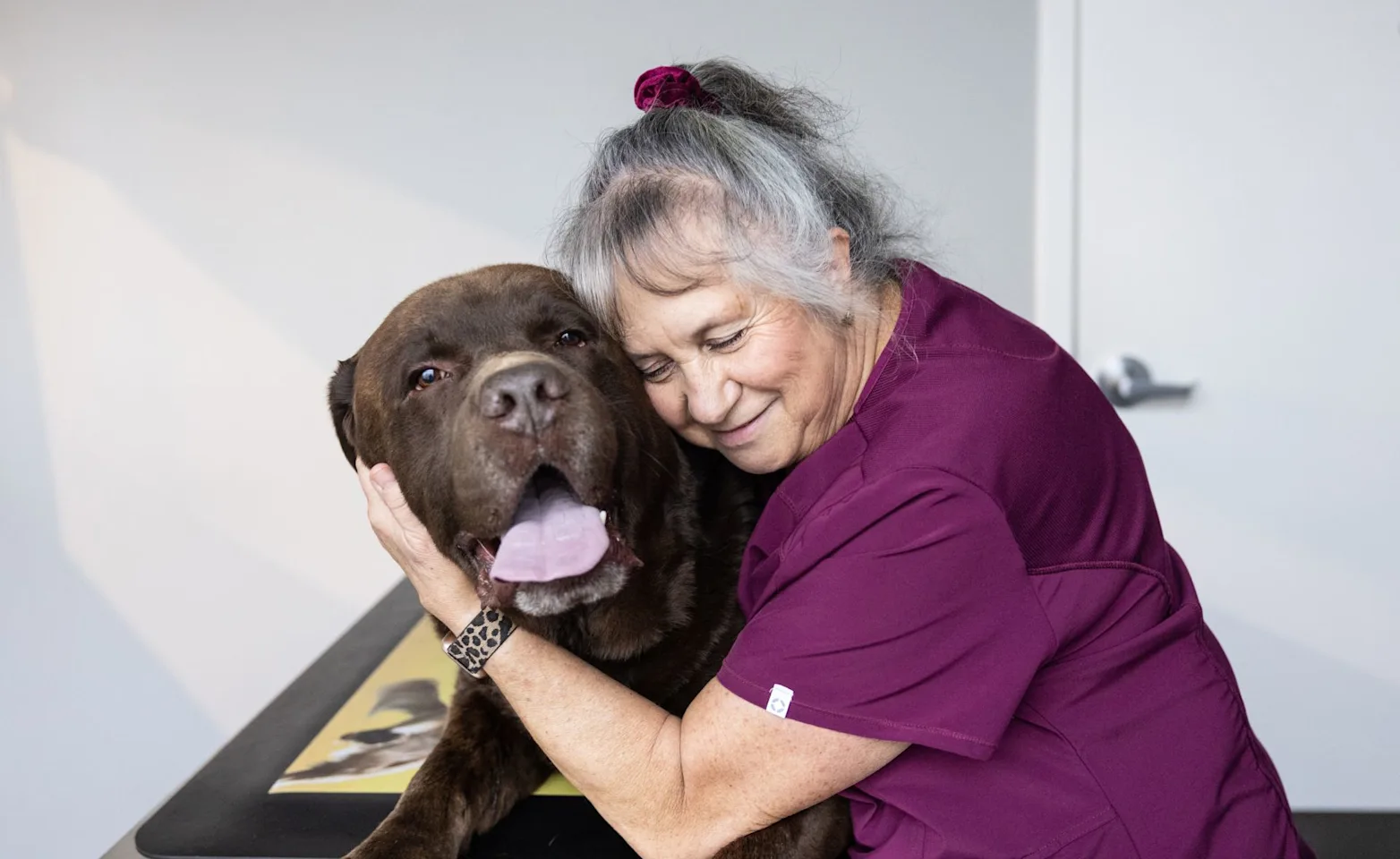 Woman hugging dog Woman hugging dog