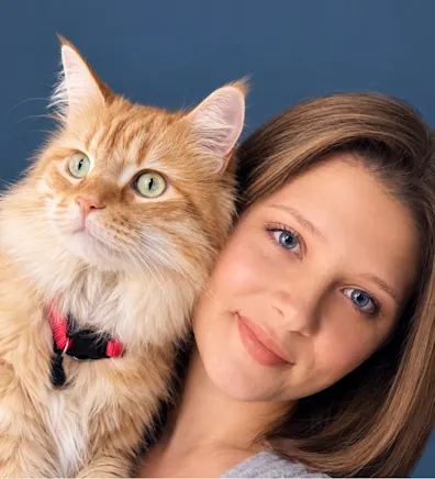 Hailey Hall, Lead Veterinary Technician at North Channel Animal Hospital, posing with a cat Hailey Hall, Lead Veterinary Technician at North Channel Animal Hospital, posing with a cat