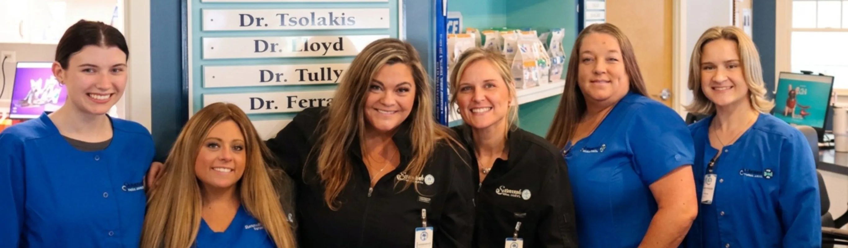 Savannah Animal Hospital staff smiling arm in arm. Savannah Animal Hospital staff smiling arm in arm.