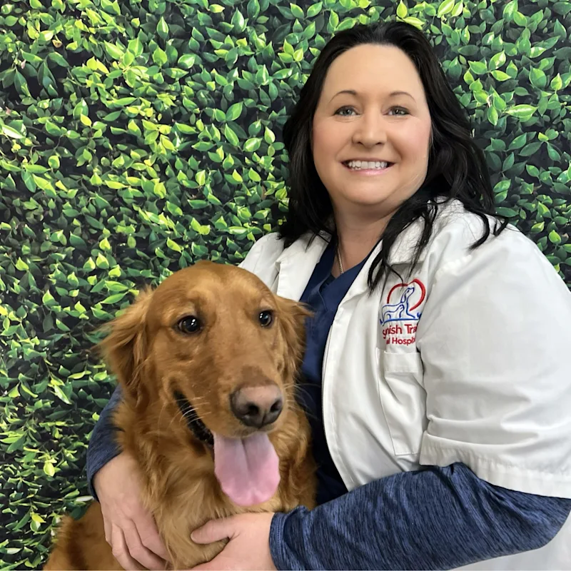 Dr. Agnes Clay-Anderson's Staff photo from Spanish Trail Animal Hospital where she is sitting outside hugging a big black dog Dr. Agnes Clay-Anderson's Staff photo from Spanish Trail Animal Hospital where she is sitting outside hugging a big black dog