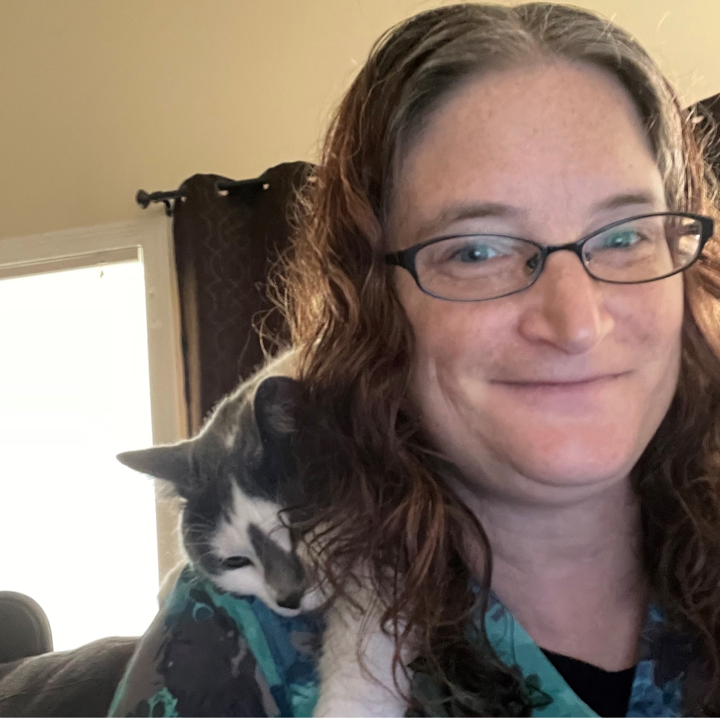 Julie with cat in her arms