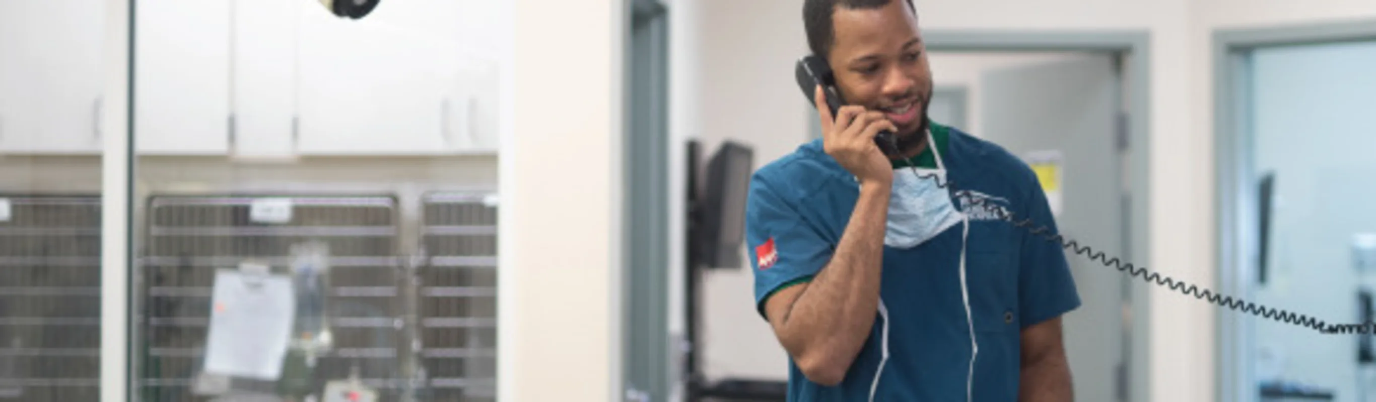 Veterinary technician answering the phone Veterinary technician answering the phone