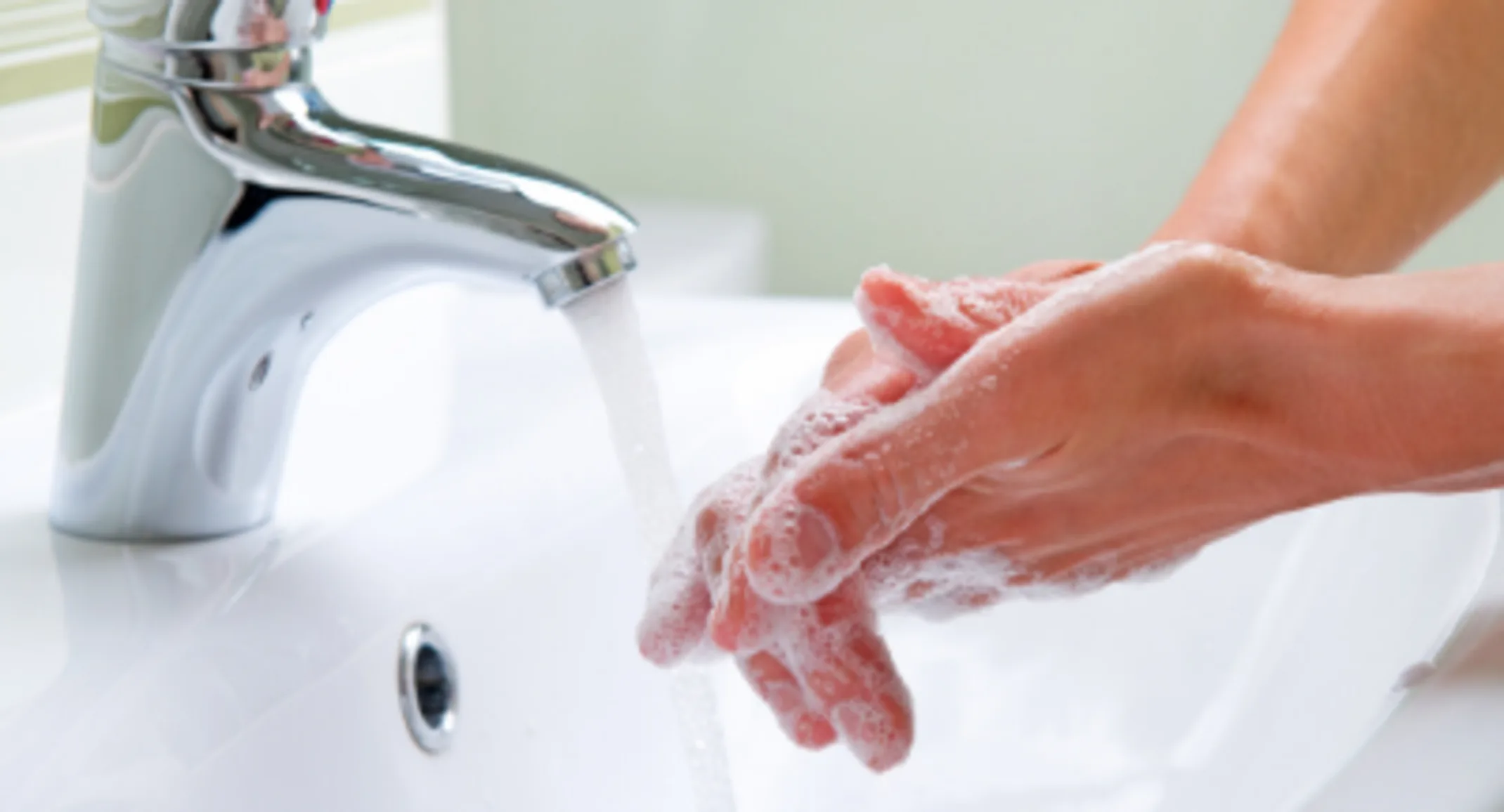 Washing hands in the sink to prevent the corona virus from spreading. Washing hands in the sink to prevent the corona virus from spreading.