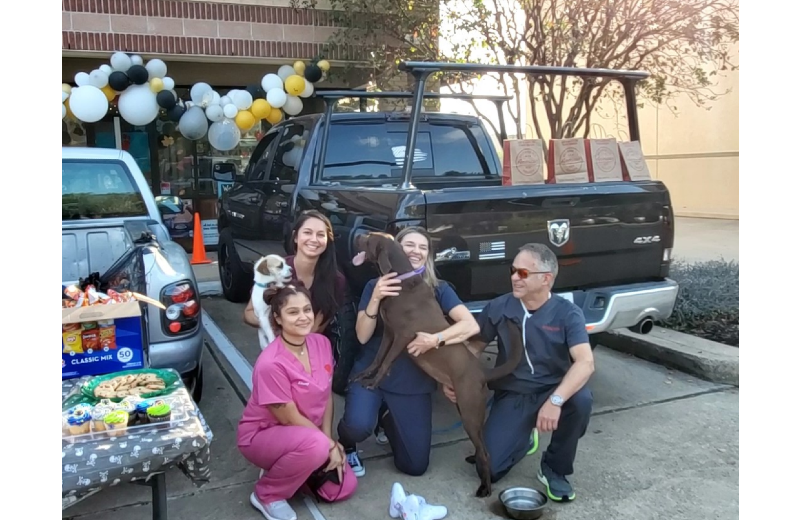 4 Staff Member Kneeling with Big Dog