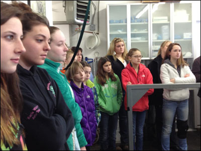 Kids in 4-H riding club listening to veterinarian