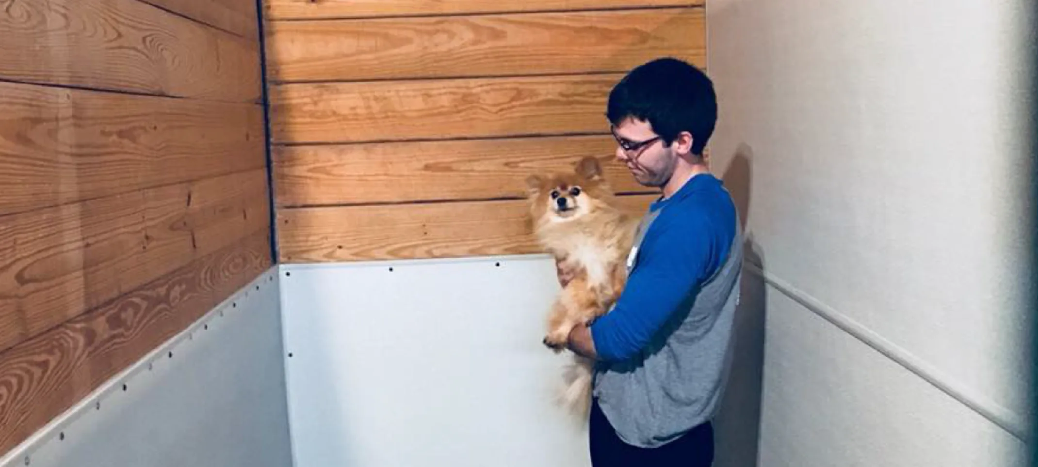 Man holding dog at boarding at the Pet Ranch