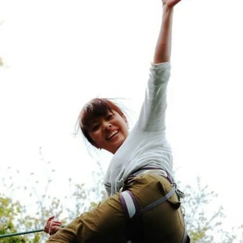 Natsuko climbing a rock and waving to the camera Natsuko climbing a rock and waving to the camera