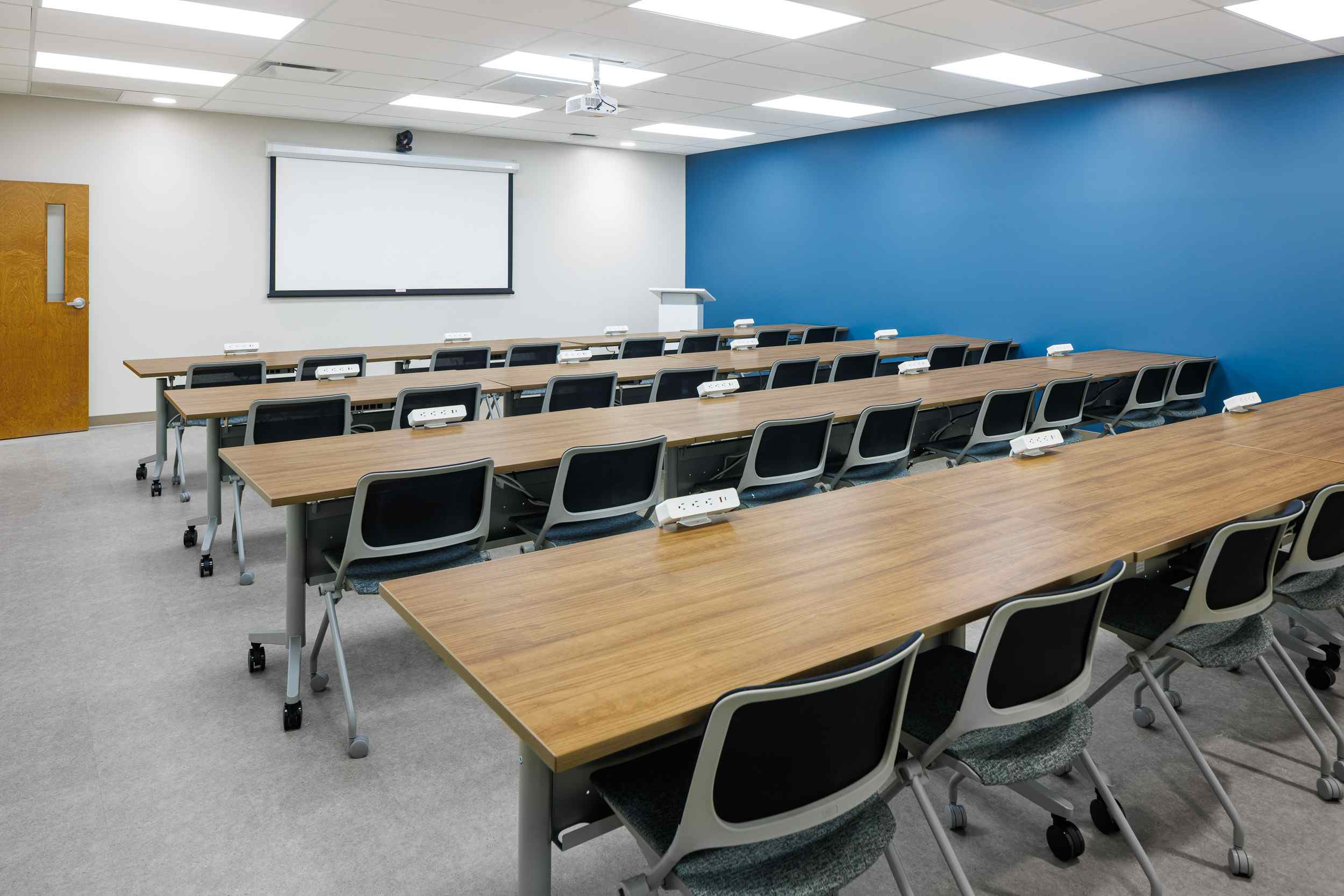 Rows of chairs in a conference room.