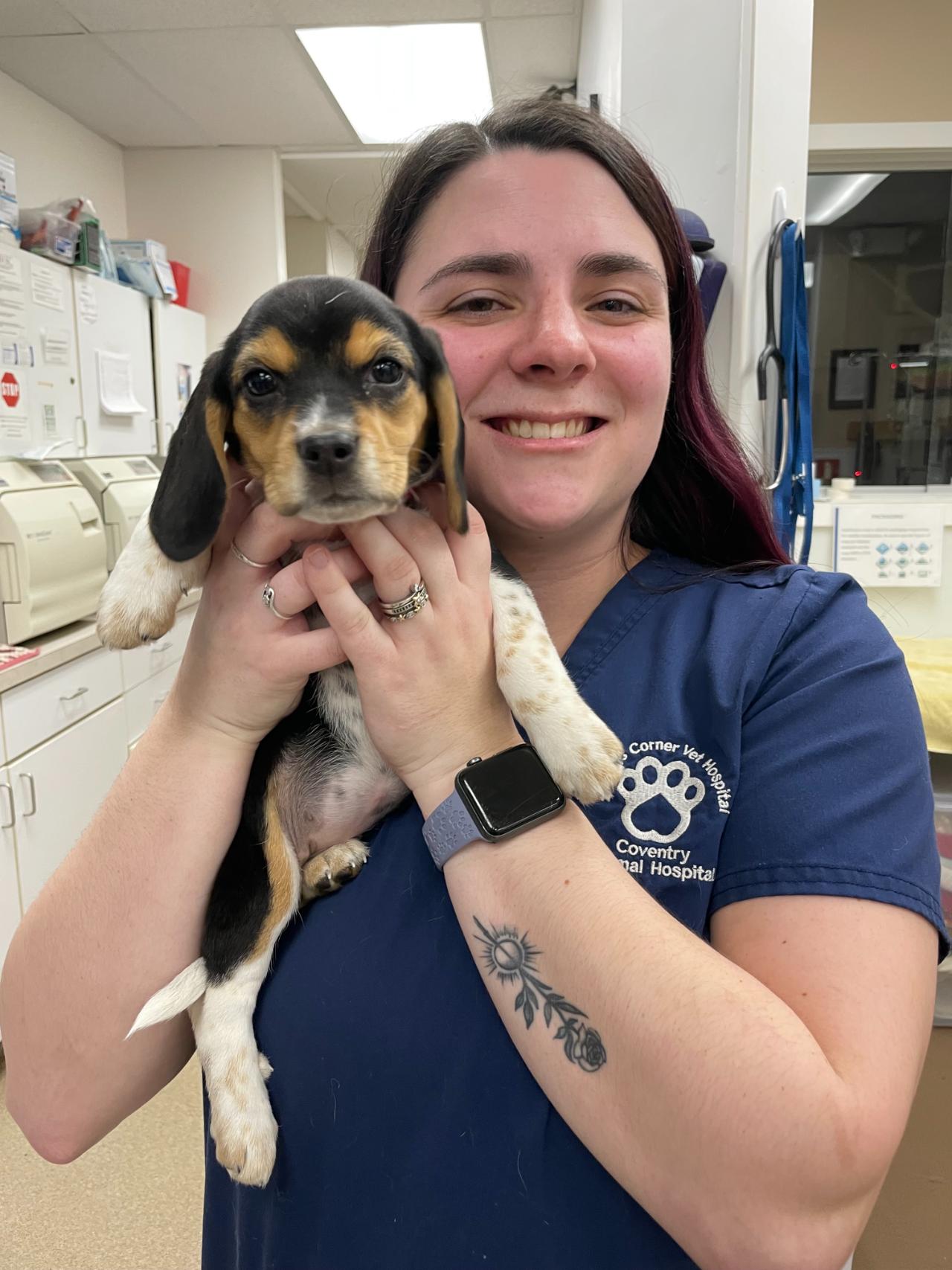 Jessica holding a small puppy