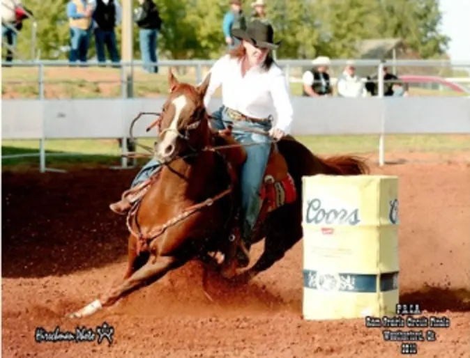 Photo of horse rider Jana riding brown horse 