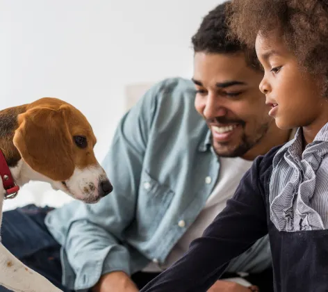 Father and son with a dog