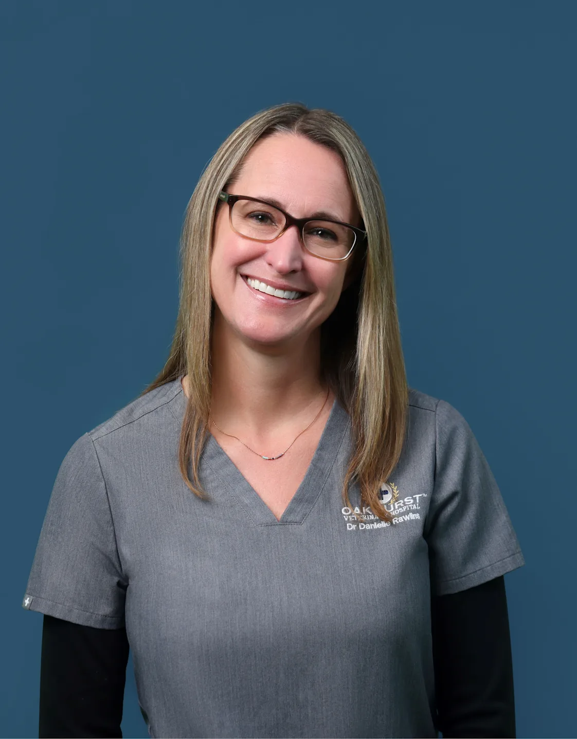 Dr. Danielle Rawlins hugging a Labrador Retriever Dr. Danielle Rawlins hugging a Labrador Retriever