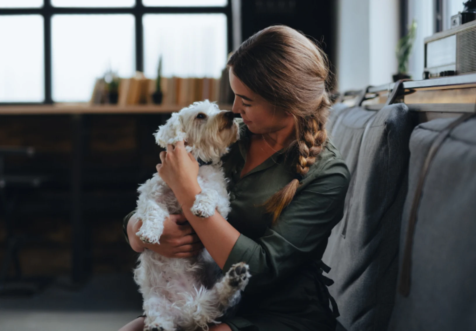 Girl Touching Noses with a White Dog Girl Touching Noses with a White Dog
