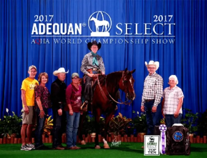 Photo of rider and horse posing for a awards show Photo of rider and horse posing for a awards show
