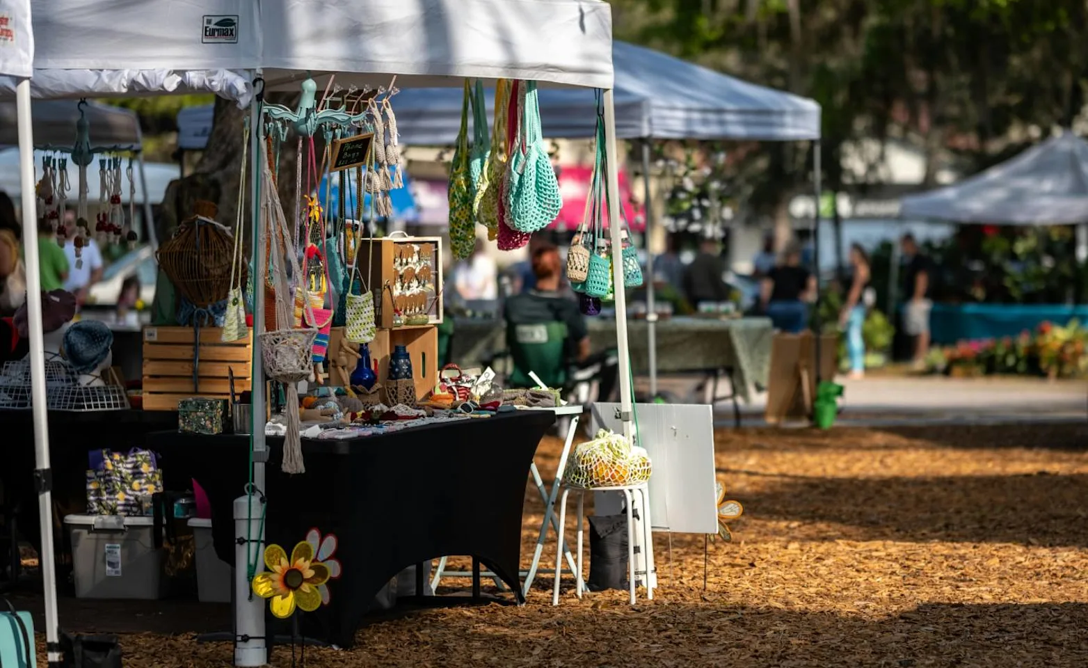 Pop-up tents lined with jewelry and crafts. Pop-up tents lined with jewelry and crafts.
