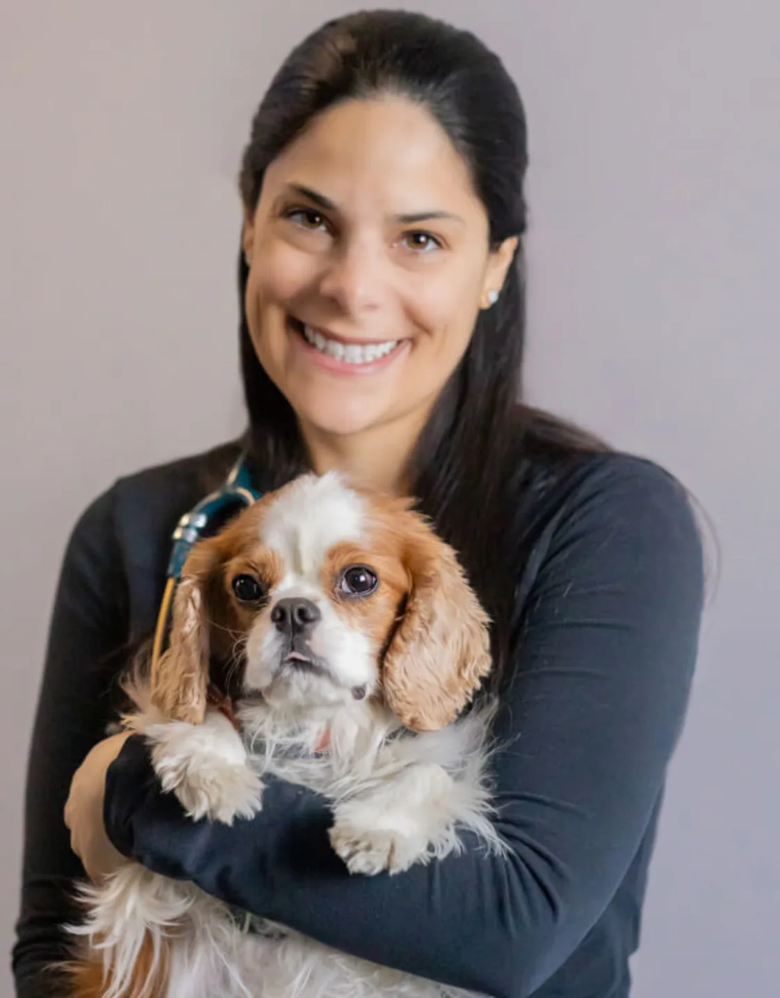 Headshot of Kimberly Hassen w/ brown and white dog Headshot of Kimberly Hassen w/ brown and white dog