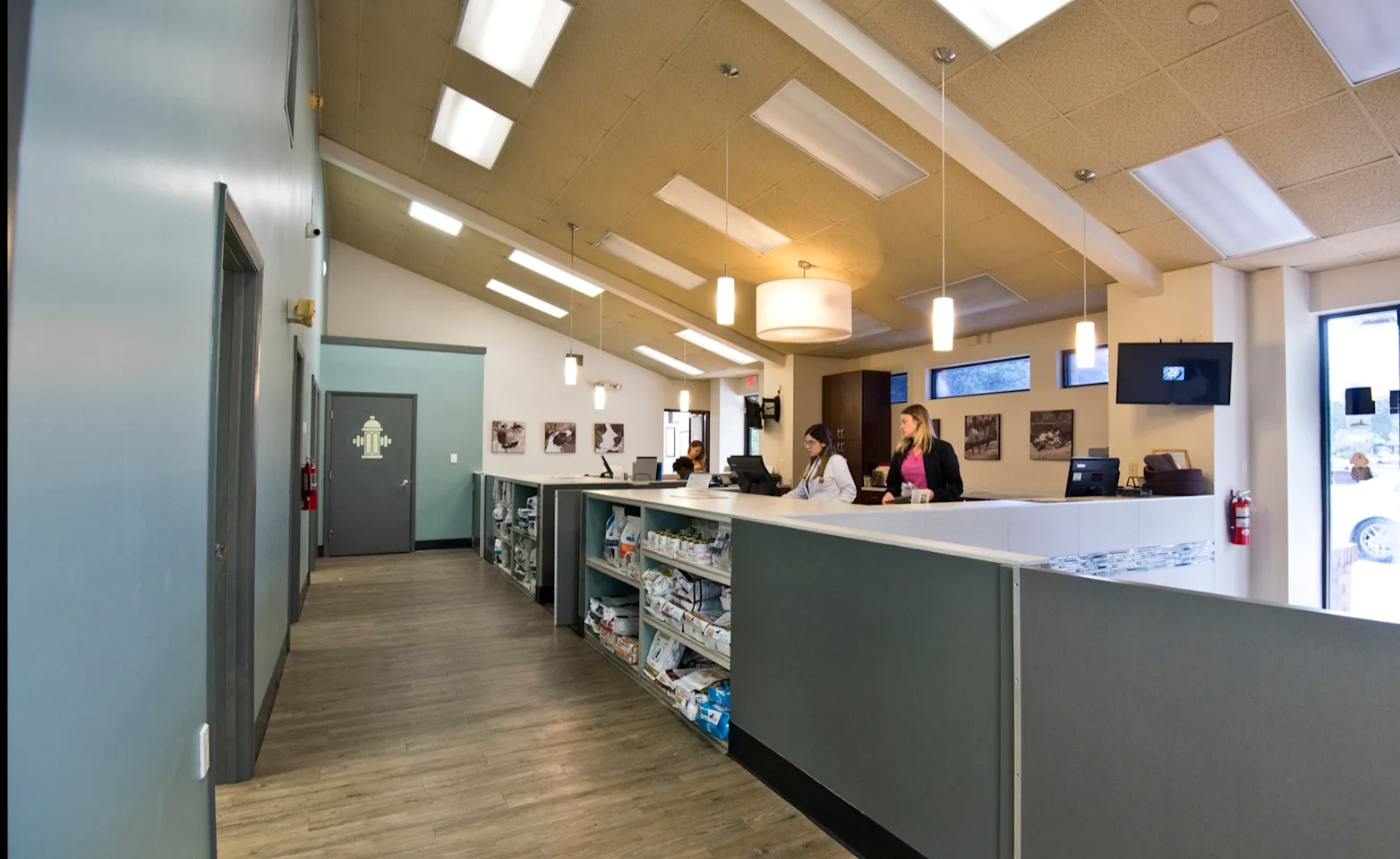 Two girls at the reception desk at Ehrlich Animal Hospital Two girls at the reception desk at Ehrlich Animal Hospital