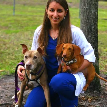 Dr. Gina Barron with two dogs