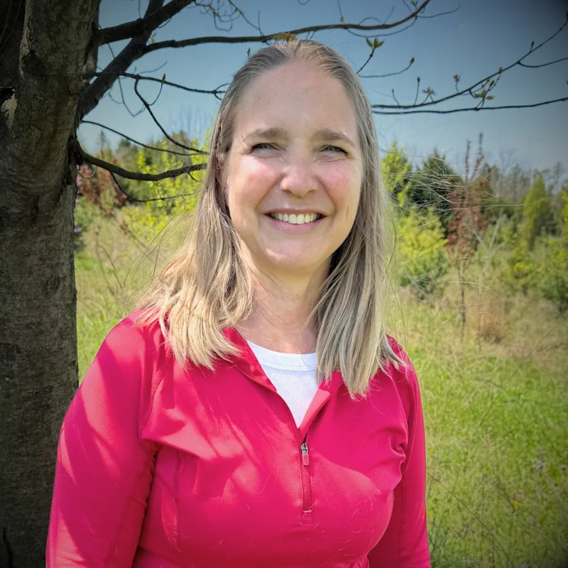 Photo of Doctor Clauser and a black dog Photo of Doctor Clauser and a black dog