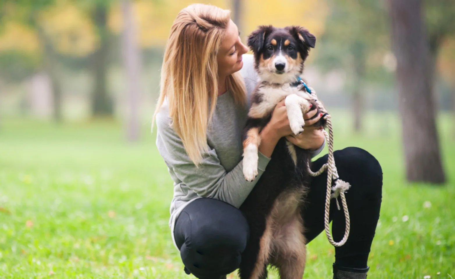 Lady with puppy in park Lady with puppy in park