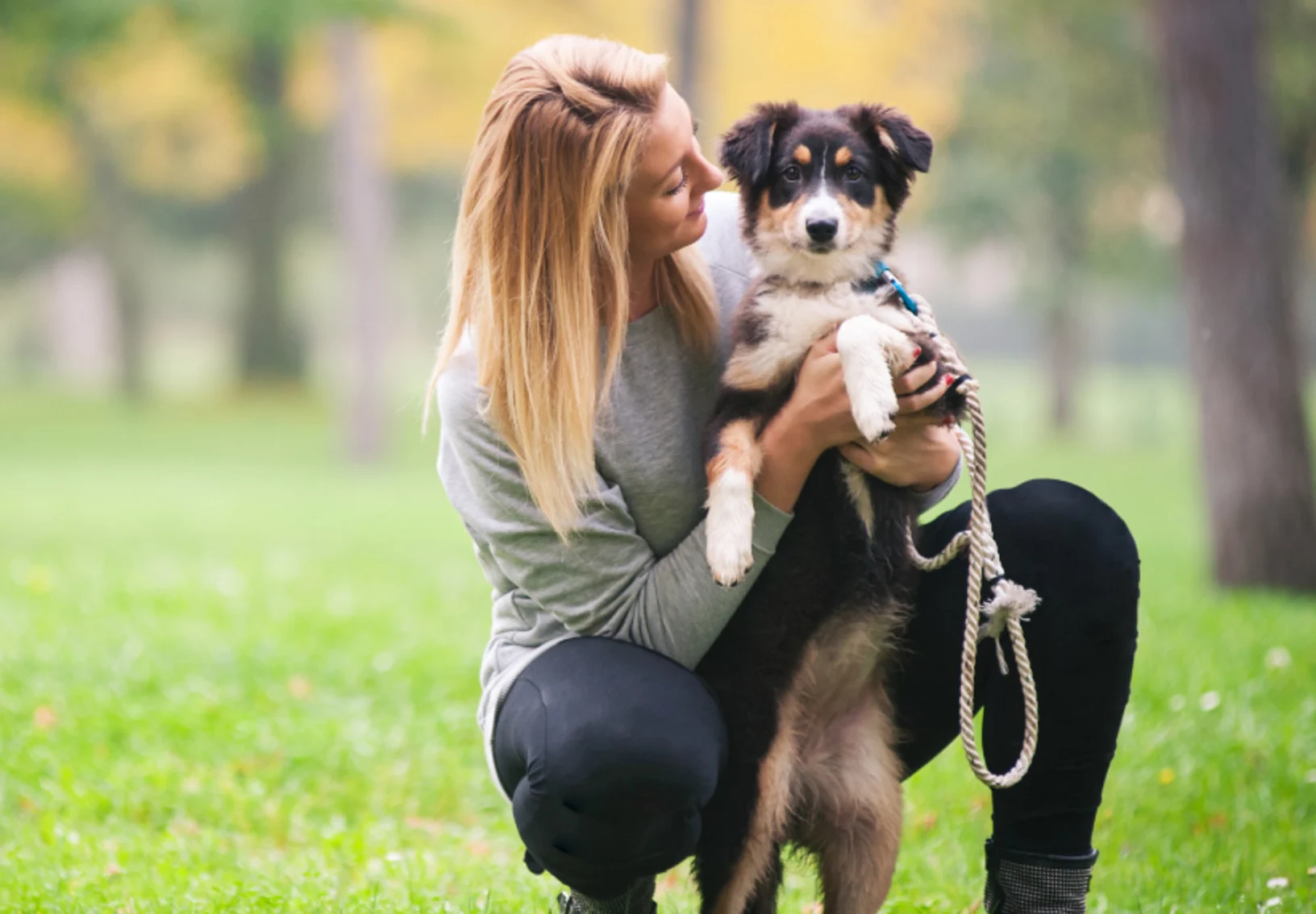 Lady with puppy in park