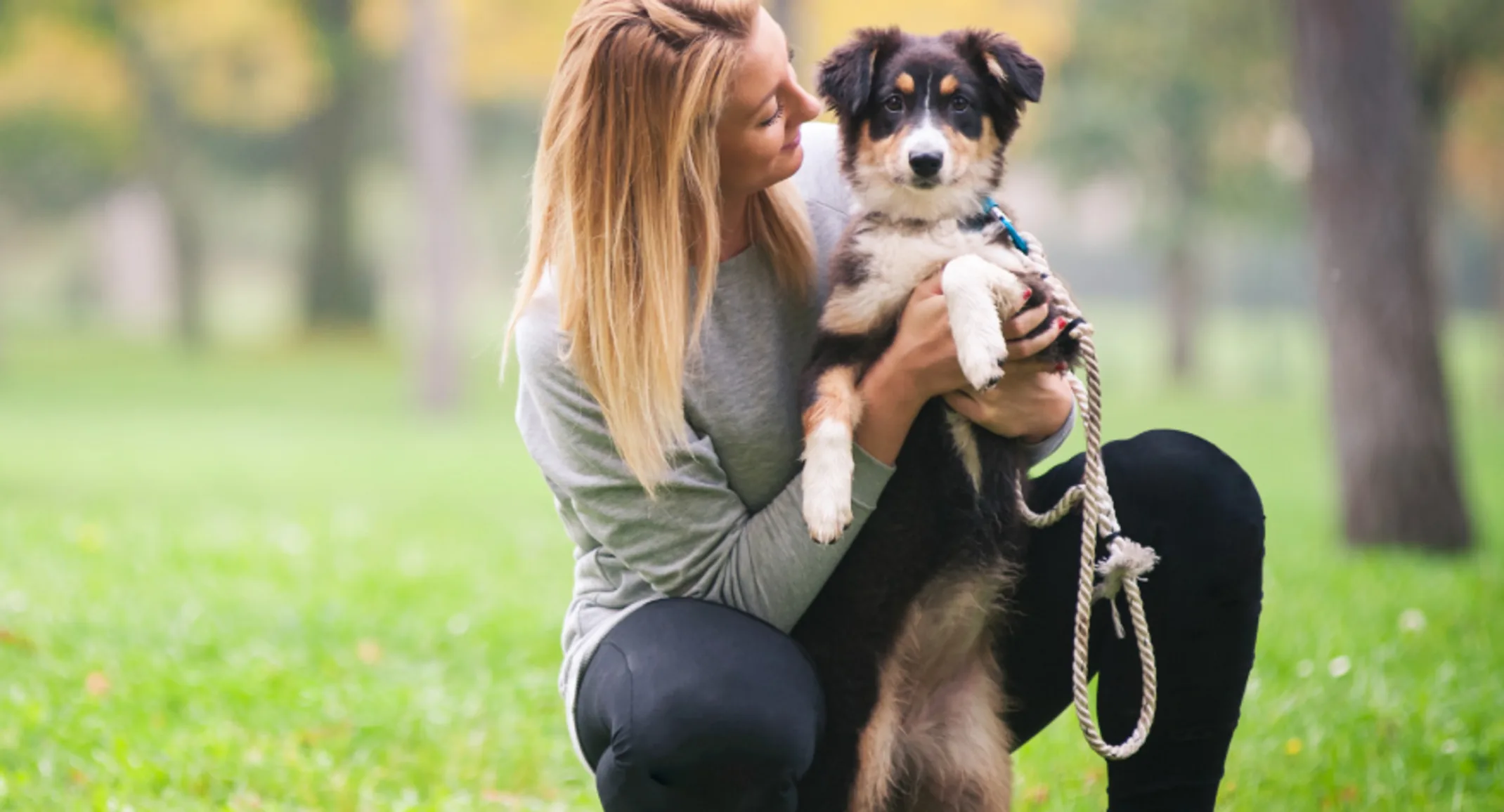Lady with puppy in park Lady with puppy in park