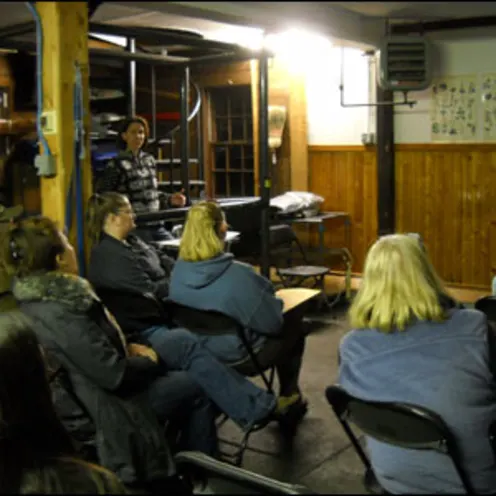 People sitting listening to seminar People sitting listening to seminar